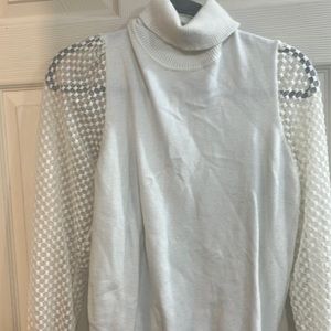 White turtleneck shirt with sheer sleeves